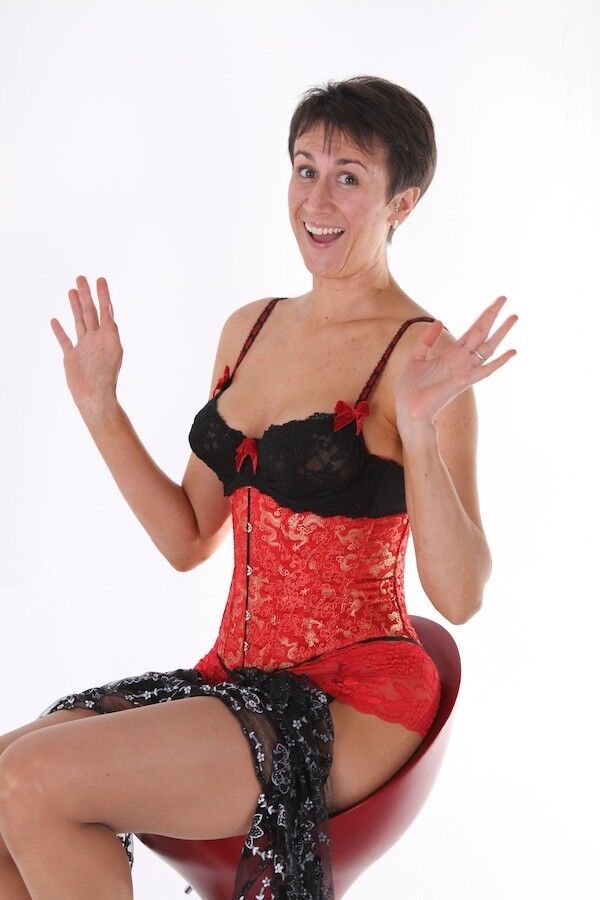 Housewife Michaela wearing a red corset