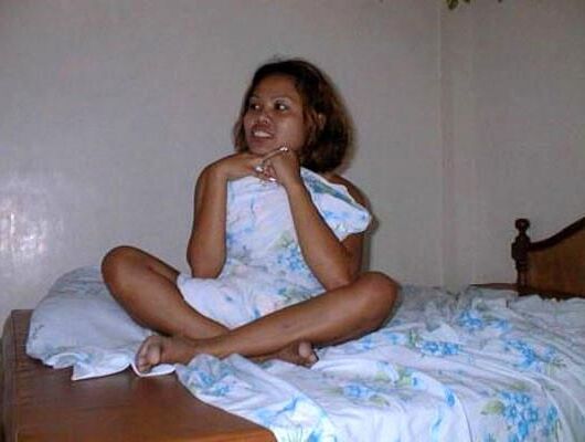Thai hooker strips and spreads her legs in Bangkok, .